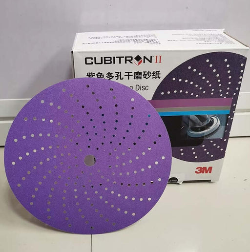 3M Cubitron II 6-inch purple cyclone sandpaper disc with hook-and-loop design and dust extraction holes.