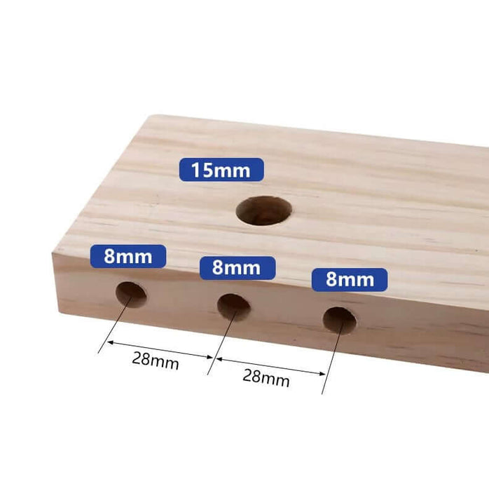 Wooden board featuring drilled holes of 8mm and 15mm, demonstrating precise measurements for doweling projects.