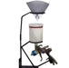 Gravity feed paint spray gun holder stand with strainer, showing mounted spray tool and paint strainer ready for use.