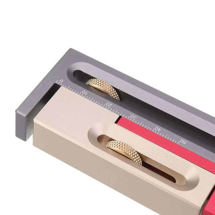 Close-up of a Table Saw Router Slot Adjuster Movable Measuring Block showing precision measurement markings and adjustable components.