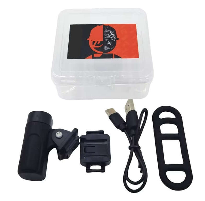 USB rechargeable spray gun light with rubber strap and USB cable in a protective case.