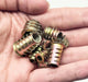 Assorted zinc alloy insert nuts held in a hand, designed for easy installation with hex key wrenches.